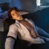 Luminous silicone boyfriend doll gay from Mendolls, posed flexibly in a neon-lit gay intimacy showcase.