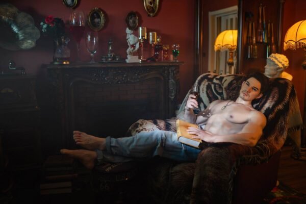 Mendolls realistic latin silicone male doll with silky smooth texture, posed in a sultry Pride night scene.