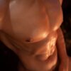 Glowing Gay Silicone Doll for Intimacy from Mendolls, posed flexibly in a neon-lit gay passion showcase