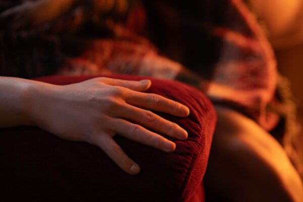 Mendolls Gay Silicone Doll for Intimacy with flexible poses, glowing in a bold gay Pride celebration shot.