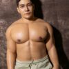 Mendolls gay fantasy silicone doll with flexible poses, radiant in a bold gay Pride parade shot