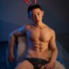 Silky realistic gay doll silicone by Mendolls, posed dynamically in a neon Pride celebration for gay passion.