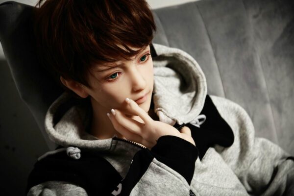 Mendolls captivating gay silicone male doll Soren, authentic texture, in a radiant gay love display.
