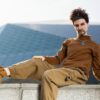 Alluring realistic silicone gay sex doll companion by Mendolls, lifelike in a starry gay passion scene.