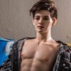 Premium male companion doll for gay by Mendolls, glowing in a twilight gay love showcase with silky texture.