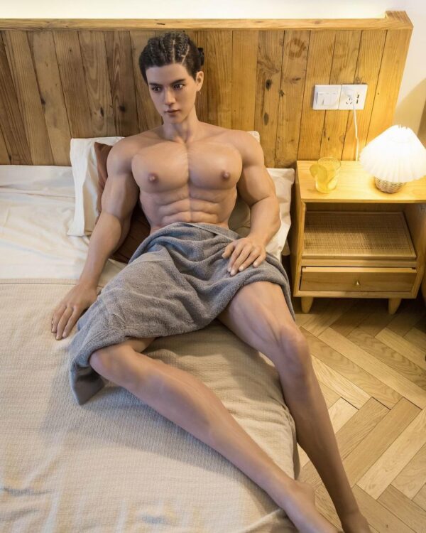 Mendolls muscle male sex doll with lifelike sculpted muscles, posed in a sultry moonlit gay scene.