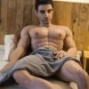 Mendolls muscle gay silicone doll, silky and flexible, showcased in a passionate urban gay passion scene.