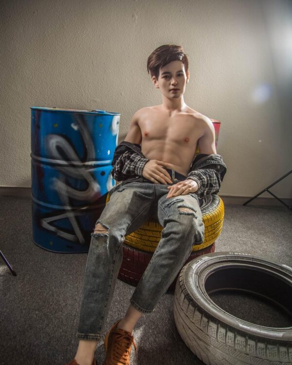 Mendolls male companion doll for gay, silky and flexible, showcased in a devoted urban gay love scene.