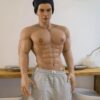 Mendolls muscle male sex doll, hyper-realistic and bold, in a neon gay fitness lifestyle scene.