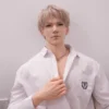 Soft silicone gay doll with youthful face, open shirt, and realistic muscle detail