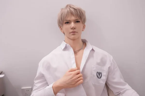 Soft silicone gay doll with youthful face, open shirt, and realistic muscle detail