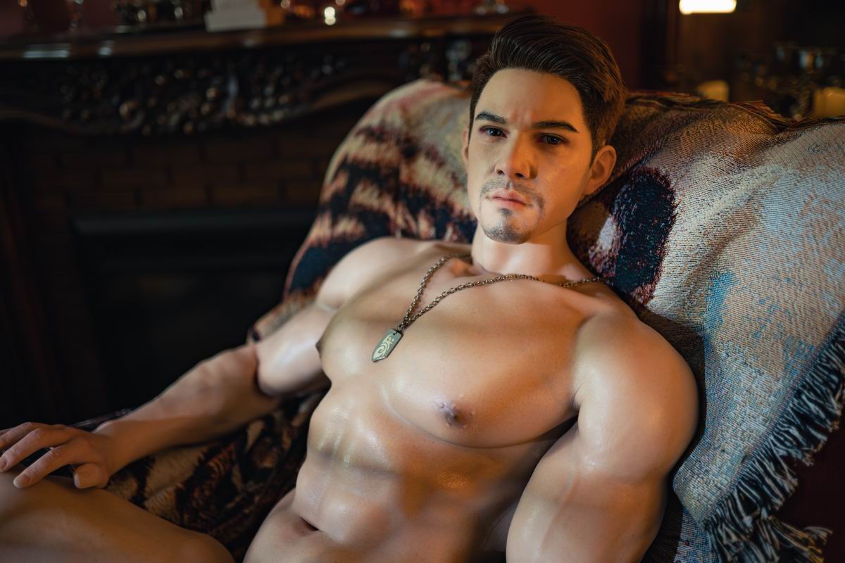 Realistic silicone male doll offering quiet companionship on a couch