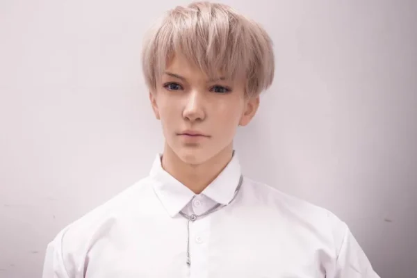 Gay-friendly silicone doll with realistic eyes and clean boyish look