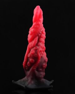 Silicone anal plug with tapered tip and flared base