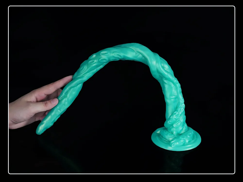 closeup of silicone anal plug held gently in hand