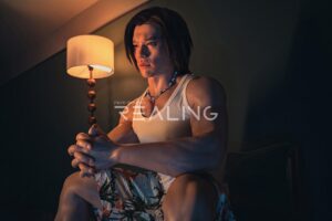 Gay man relaxing with silicone companion on couch