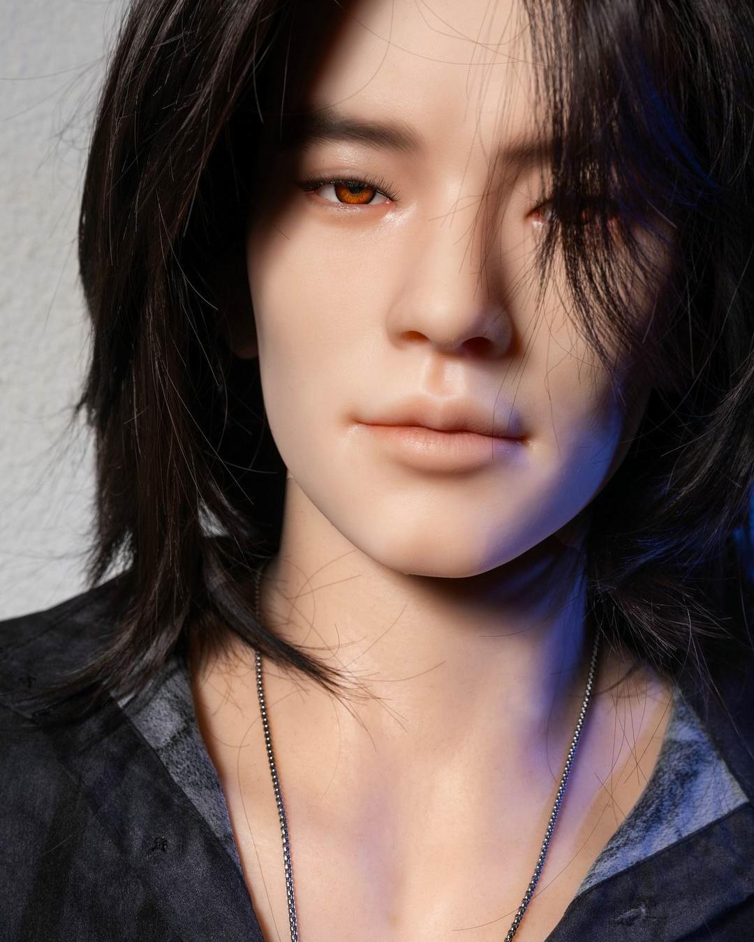 Close-up of a lifelike gay companion doll face with gentle lighting