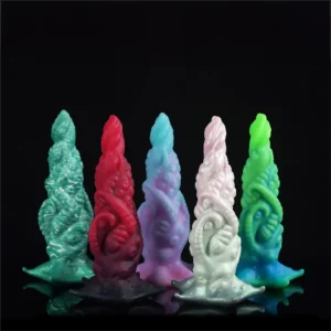 gay beginner sex toy kit with lube and plug on bed