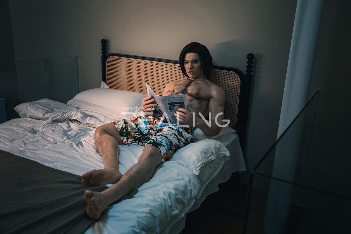 Close-up of realistic male doll features in a cozy bedroom