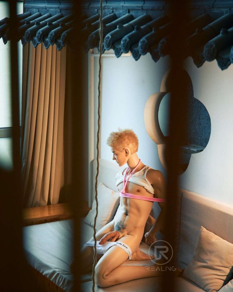 BDSM accessories arranged with a male sex doll
